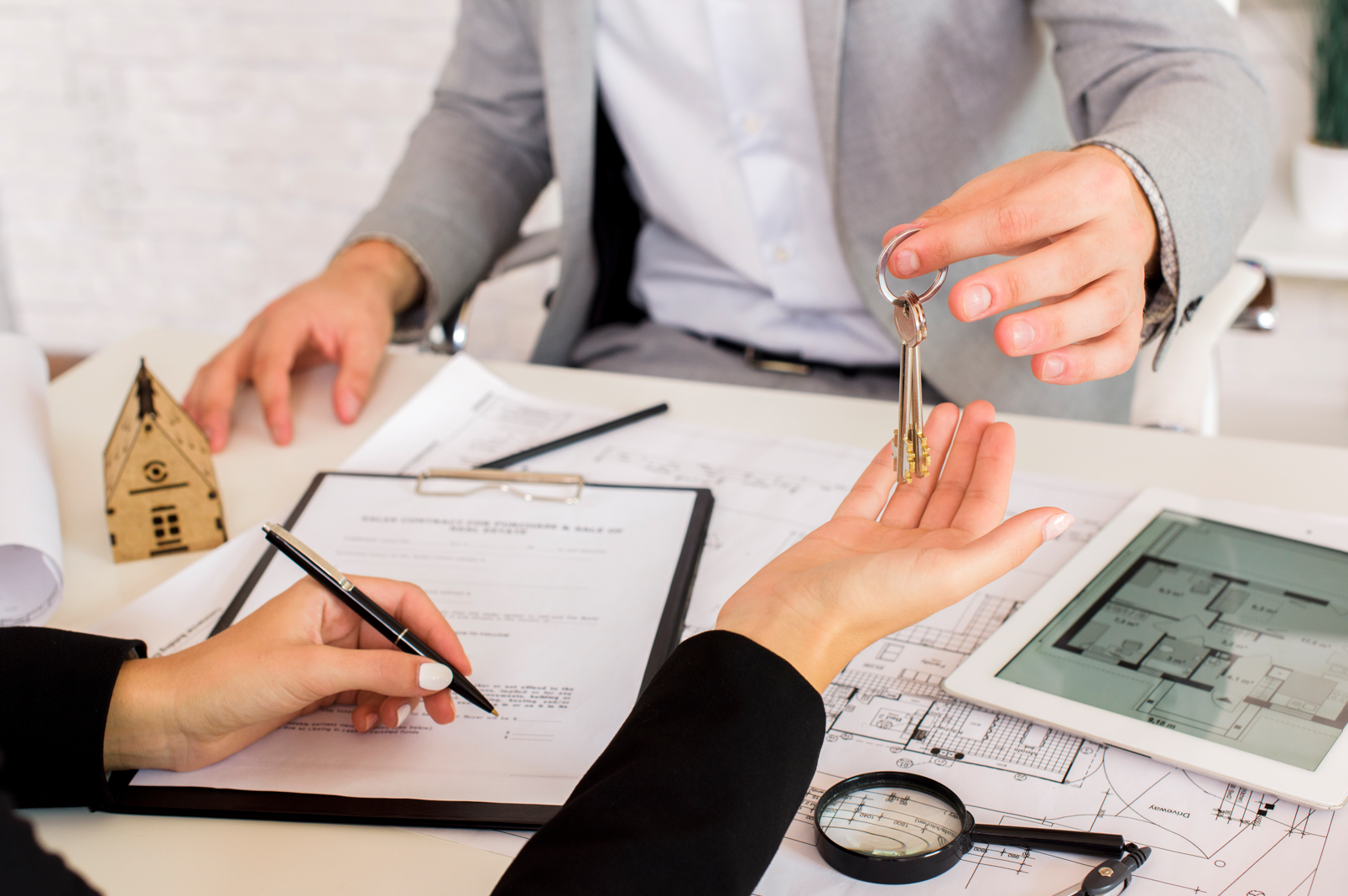 Friendly real-estate agent talking to a client